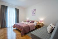 Posteľ alebo postele v izbe v ubytovaní Melita Center Apartment
