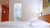 Postel nebo postele na pokoji v ubytování Central Hotel Löwen