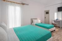 Postel nebo postele na pokoji v ubytování Villa Kavallaris & Apartments