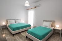 Postel nebo postele na pokoji v ubytování Villa Kavallaris & Apartments