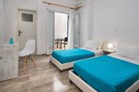 Postel nebo postele na pokoji v ubytování Villa Kavallaris & Apartments