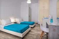 Postel nebo postele na pokoji v ubytování Villa Kavallaris & Apartments