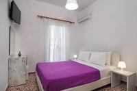 Postel nebo postele na pokoji v ubytování Villa Kavallaris & Apartments