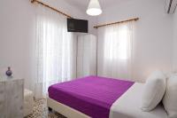 Postel nebo postele na pokoji v ubytování Villa Kavallaris & Apartments