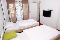 Posteľ alebo postele v izbe v ubytovaní Apartmani Nova