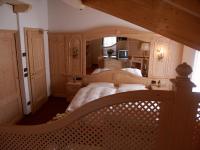 A bed or beds in a room at Hotel El Mondin
