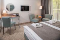 Łóżko lub łóżka w pokoju w obiekcie SeaPark Hotel Wellness & Spa