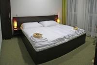Posteľ alebo postele v izbe v ubytovaní Penzion Luxury