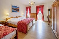 Posteľ alebo postele v izbe v ubytovaní Hotel Aquila