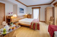Posteľ alebo postele v izbe v ubytovaní Hotel Aquila