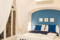 Posteľ alebo postele v izbe v ubytovaní Capri Blue