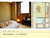 ホテル　ロスイン高知にあるベッド