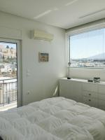 Posteľ alebo postele v izbe v ubytovaní Mind-blowing Acropolis View Apt