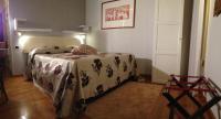 A bed or beds in a room at La Dogana