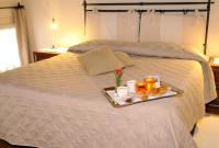 A bed or beds in a room at La Dogana