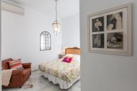 Posteľ alebo postele v izbe v ubytovaní Apartamentos Plaza Pilatos