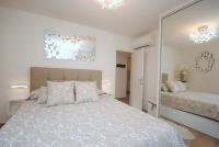 Posteľ alebo postele v izbe v ubytovaní Apartments Kogo