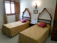 Posteľ alebo postele v izbe v ubytovaní Hostal Meson la Cadena