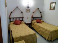 Posteľ alebo postele v izbe v ubytovaní Hostal Meson la Cadena