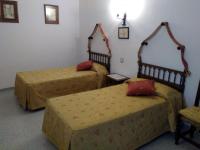 Posteľ alebo postele v izbe v ubytovaní Hostal Meson la Cadena