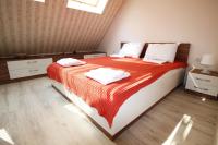 Postel nebo postele na pokoji v ubytování Lilly Apartments