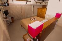 an overhead view of a bed in a room at Rinjani Lodge in Senaru