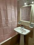 room with shared bath behind the kitchen