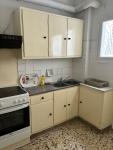 room with shared bath behind the kitchen
