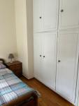room with shared bath behind the kitchen