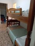 Wooden bunk bed in a dorm 5' from metro