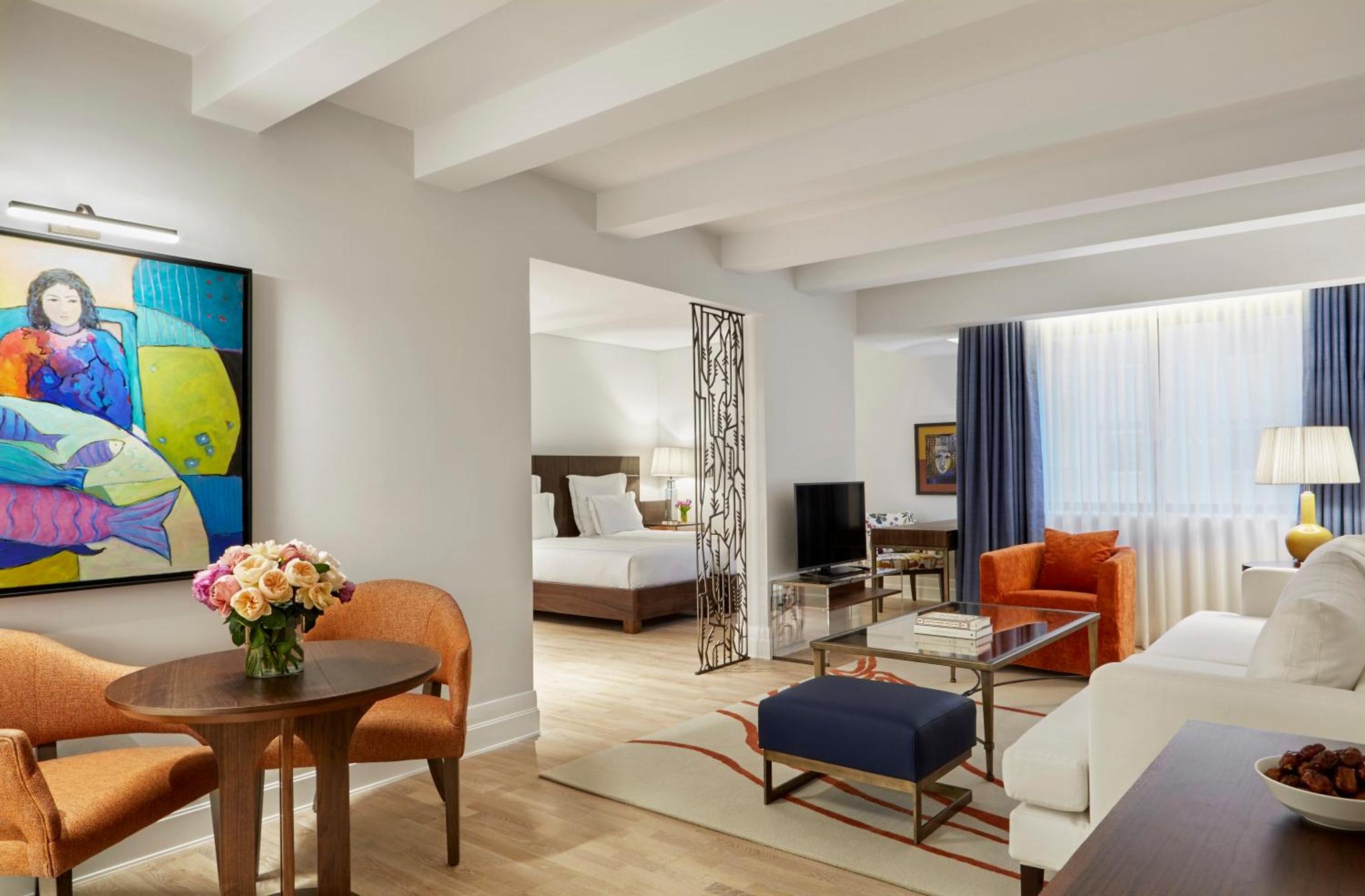 a living room with a couch and a table at The Merchant House in Manama +59 photos