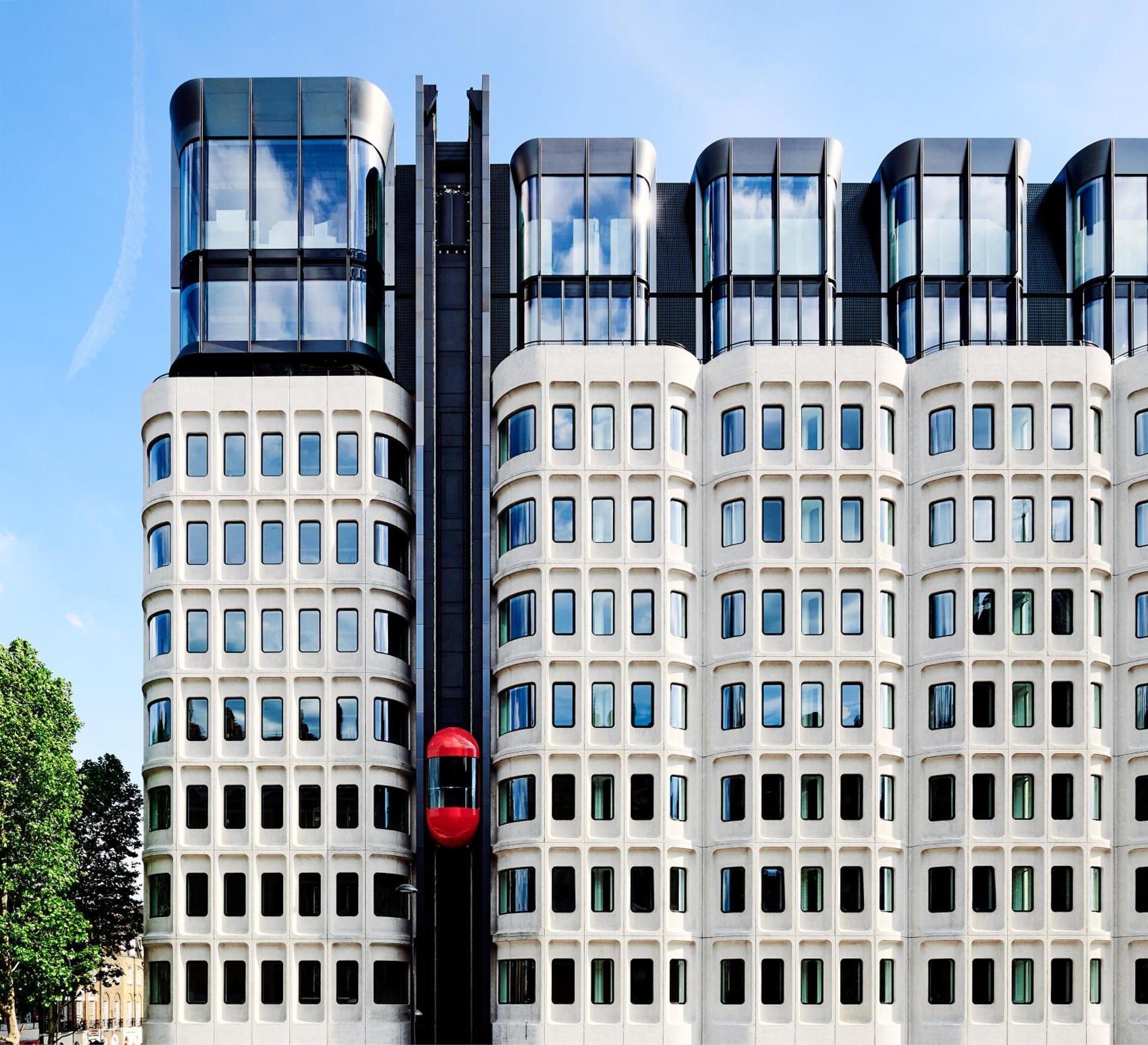 a building with a red traffic light in front of it at The Standard London in London