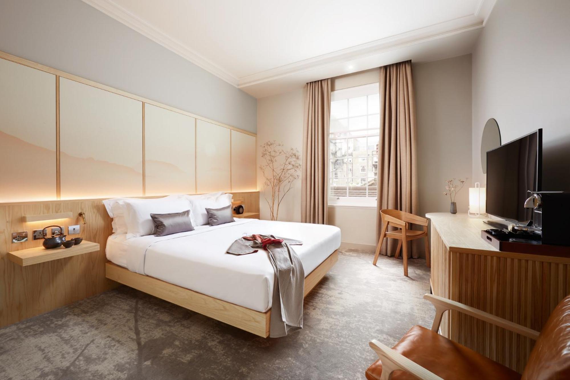 a hotel room with a bed and a television at The Prince Akatoki London in London