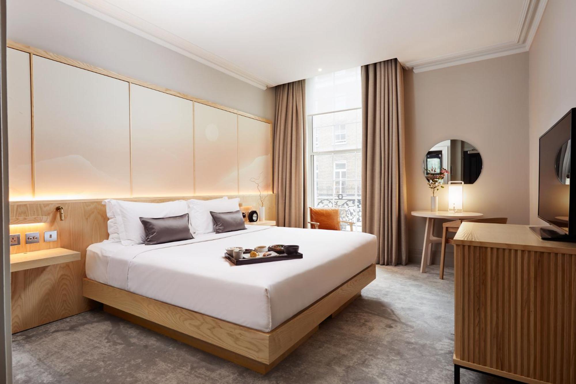 a hotel room with a bed and a television at The Prince Akatoki London in London