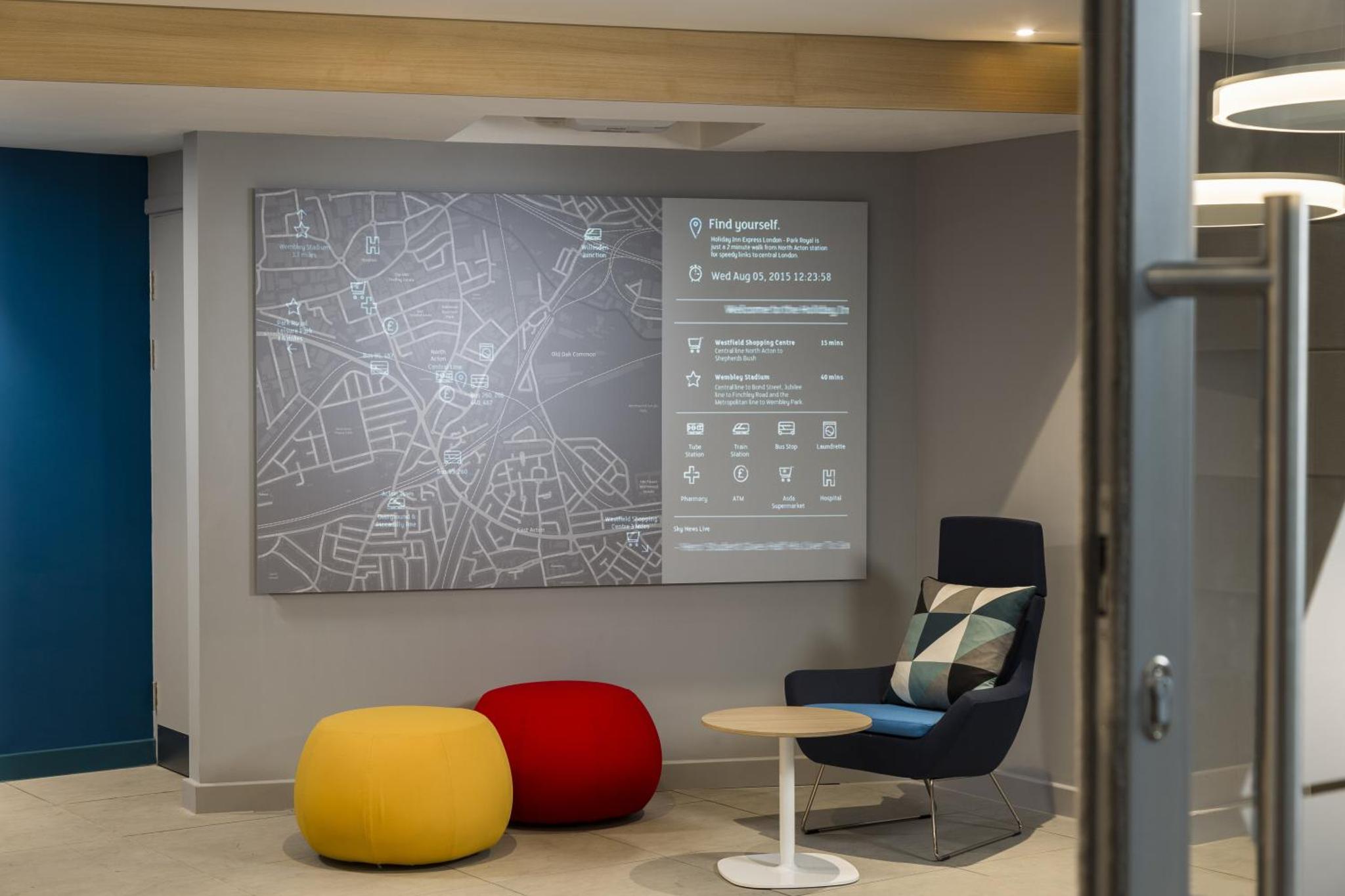 a meeting room with a map on the wall at Holiday Inn Express Park Royal by IHG in London +35 photos