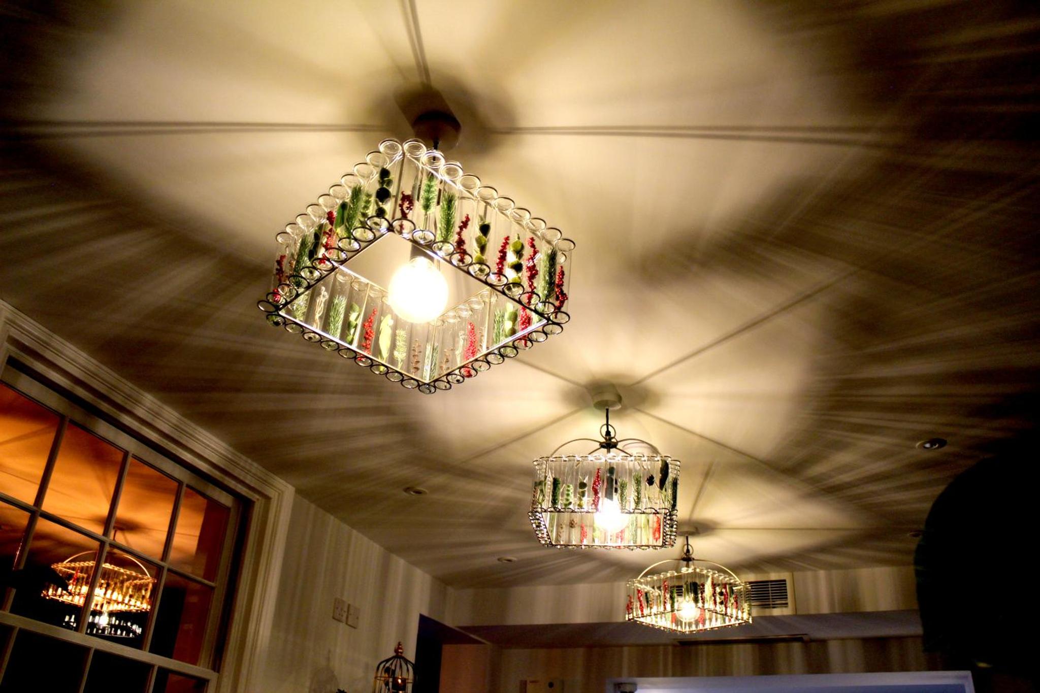 two chandeliers hanging from the ceiling of a room at 1 Craven Hill Gardens in London +36 photos