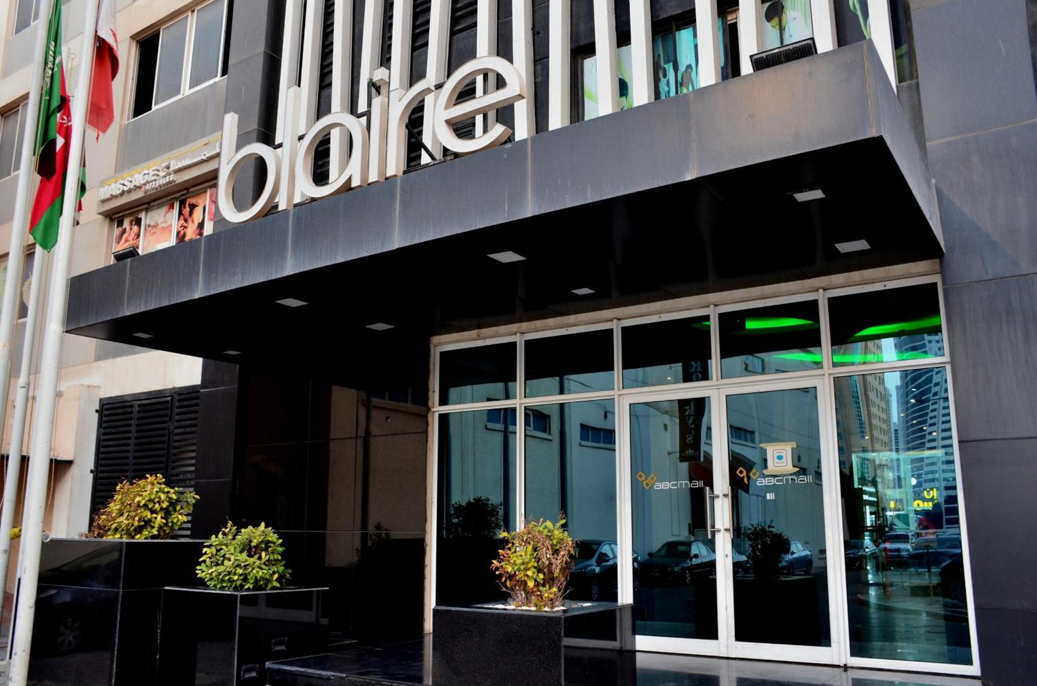 a building with a sign on the side of it at Blaire Executive Suites in Manama