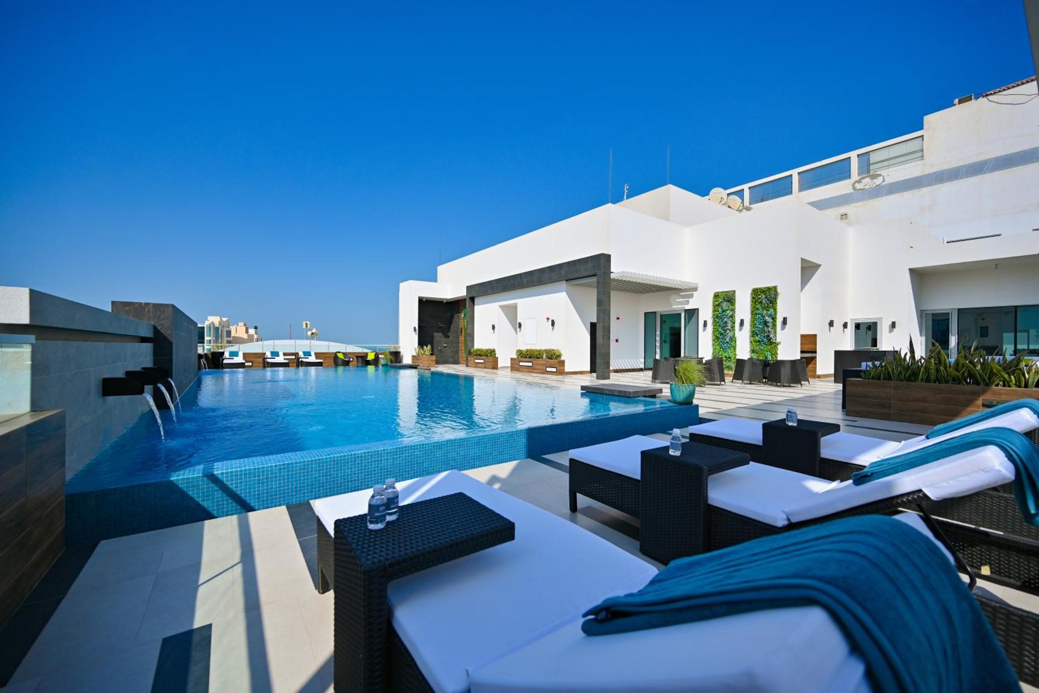 a view of a swimming pool from a villa at Springfield Suites in Seef