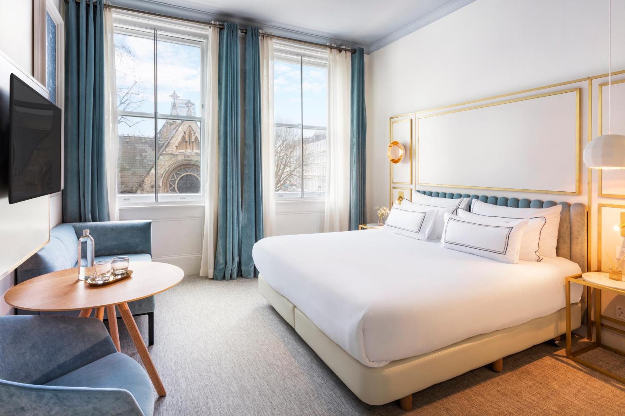 a hotel room with a large bed and a window at Meliá London Kensington Member of Meliá Collection in London +99 photos