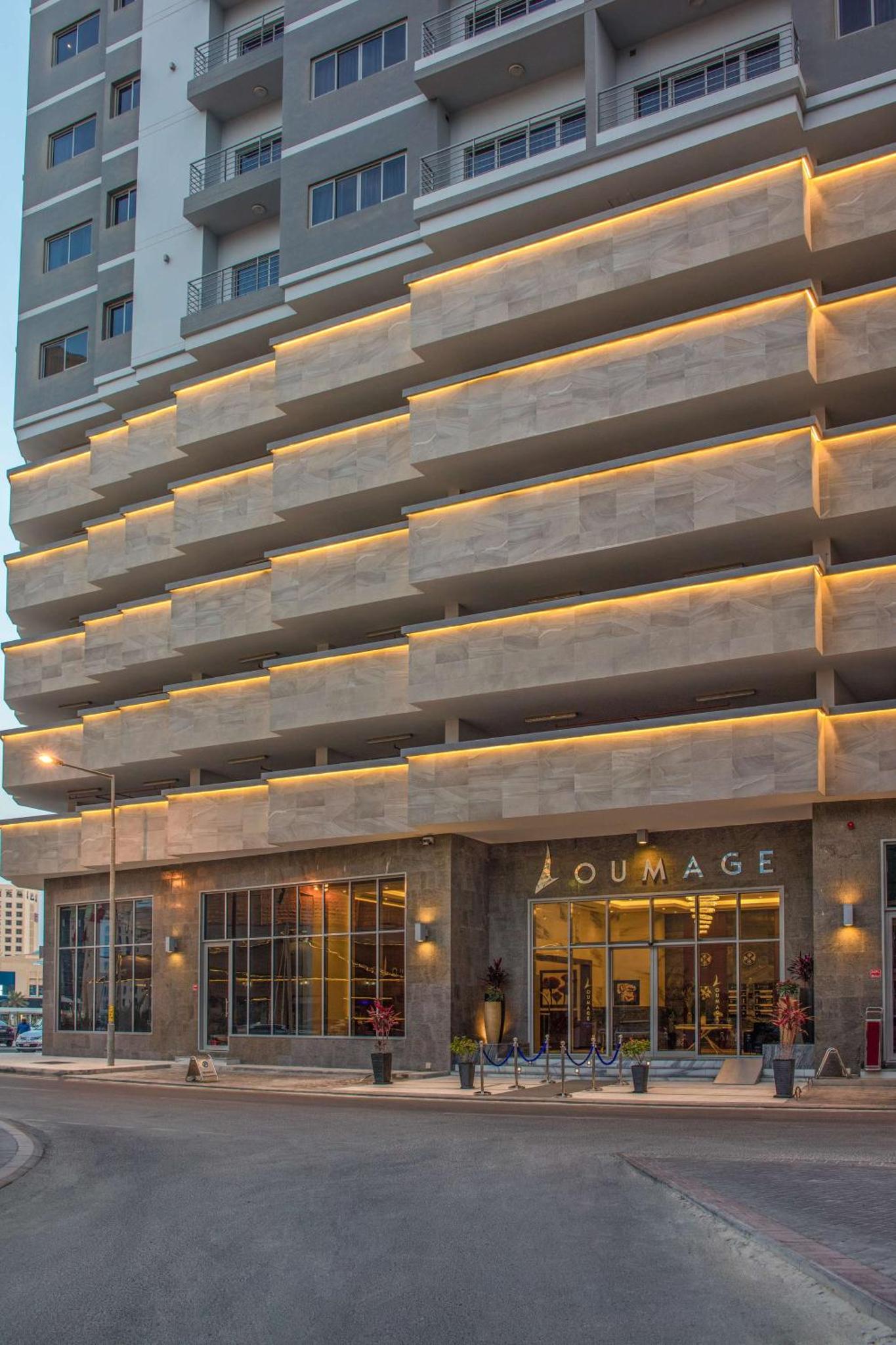 a building in front of a building at Loumage S Suites and Spa in Manama