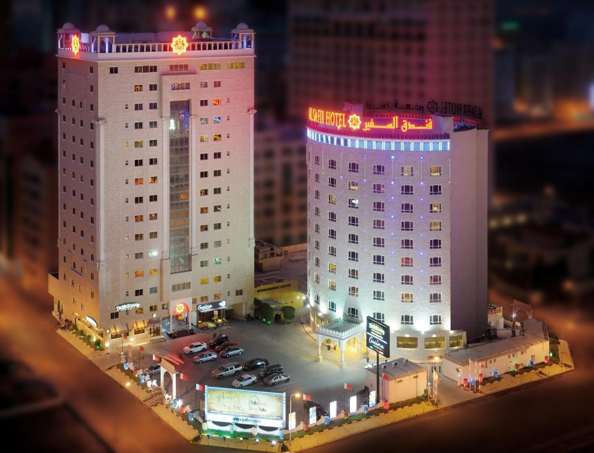 a model of a large building with a parking lot at Al Safir Hotel in Manama