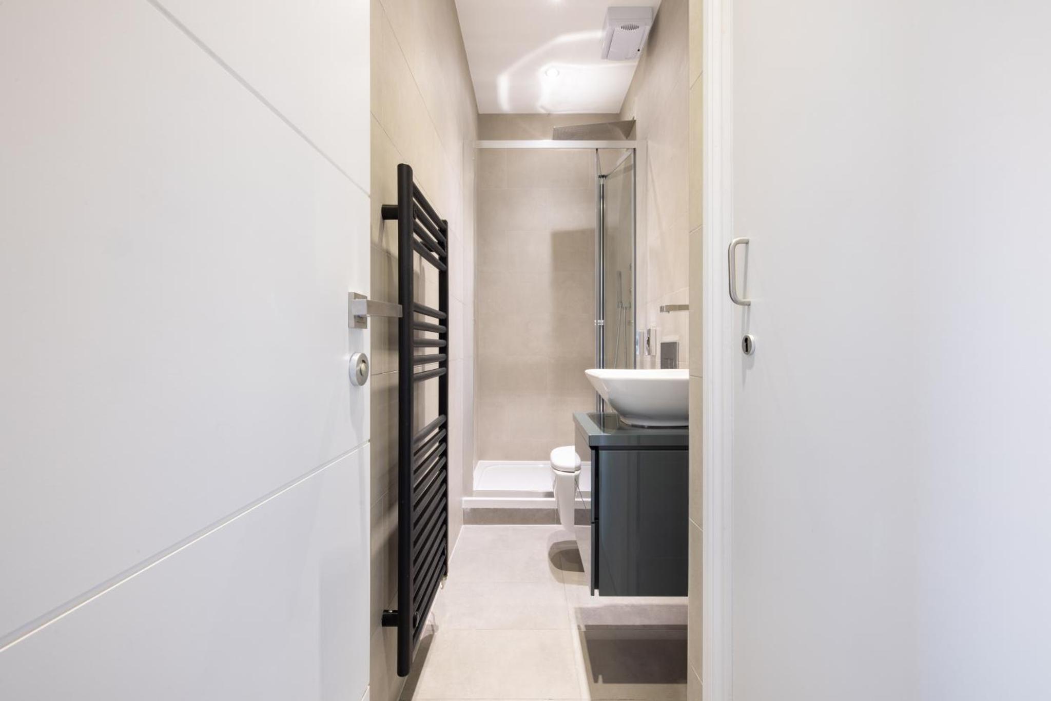 a bathroom with a toilet and a sink at Hausd Flex - Covent Garden in London