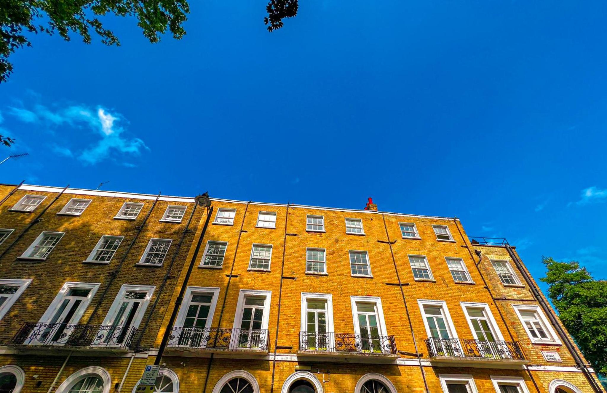 a large orange brick building with white windows at Argo Hotel - Kings Cross in London +17 photos