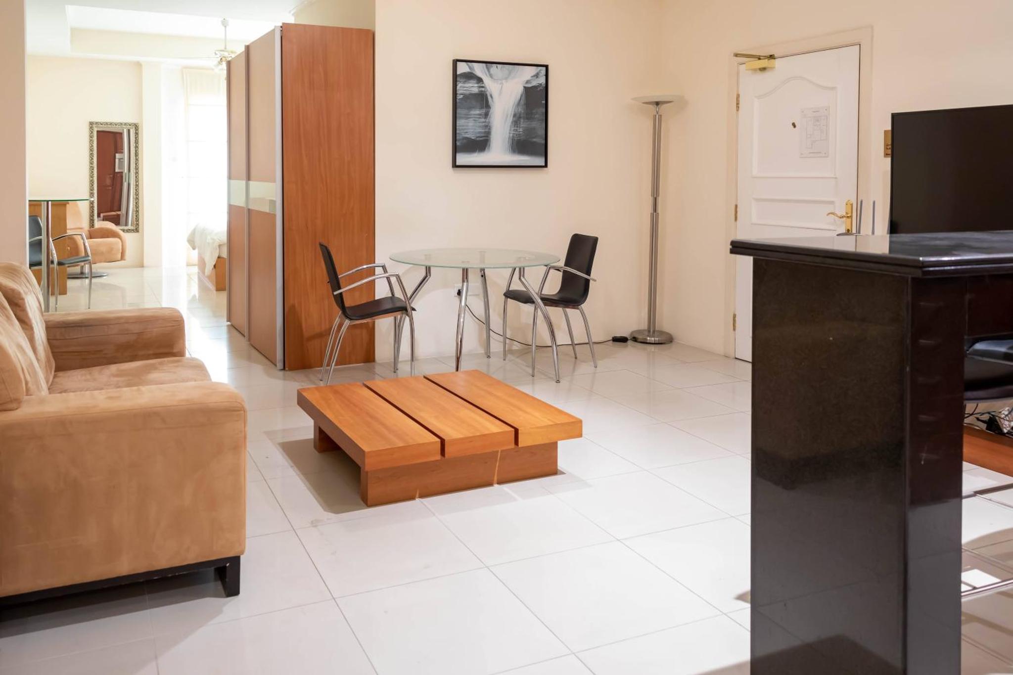 a living room with a couch and a table at Mansouri Mansions Hotel in Manama +45 photos