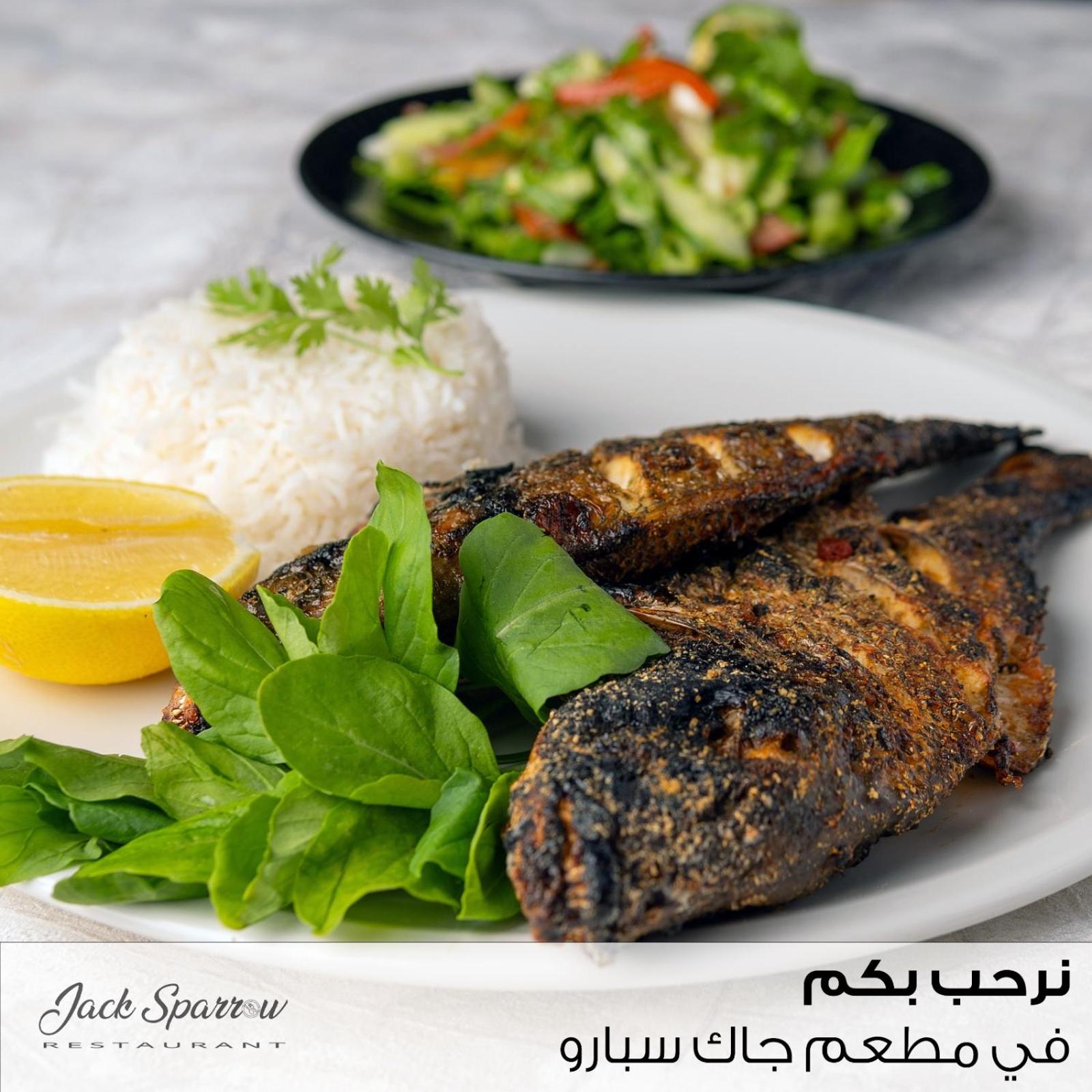 a white plate of food with rice and vegetables at Majestic Hotel in Manama