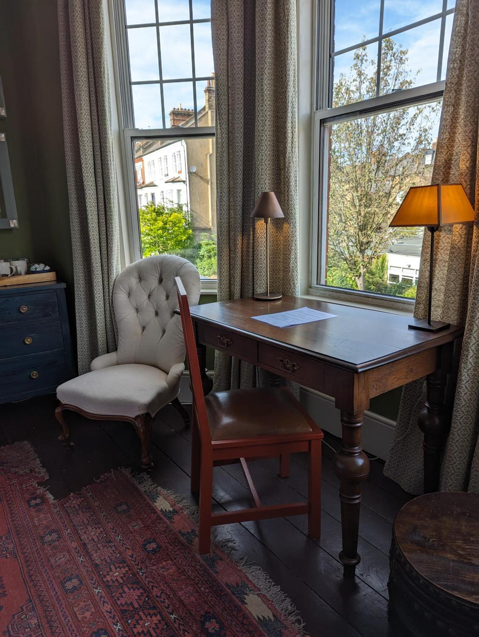 an office with a desk and a chair and a window at Trent Rd in London
