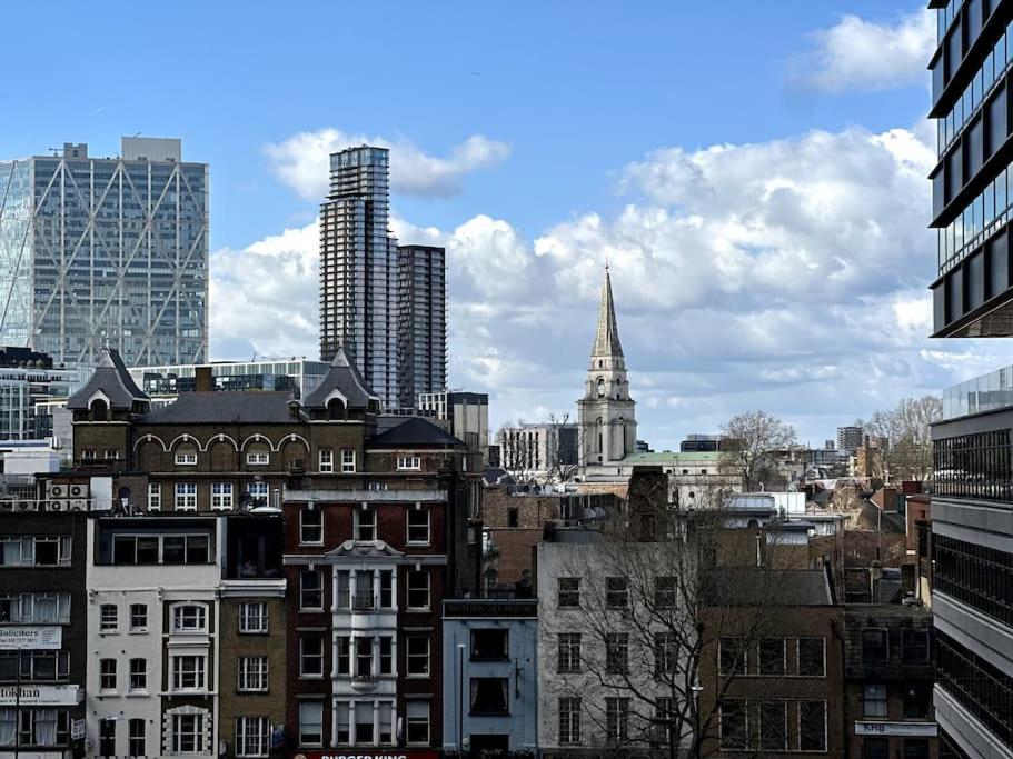 a view of a city with tall buildings at The Glamour of Shoreditch in London