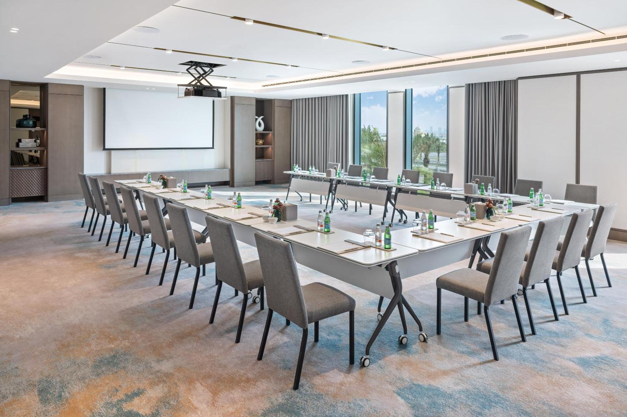 a large conference room with a long table and chairs at Address Beach Resort Bahrain in Manama +62 photos