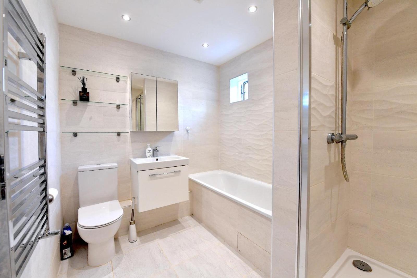 a bathroom with a toilet and a sink and a shower at Central London 2 bedrooms apartment sleep 6 Free parking in London +6 photos