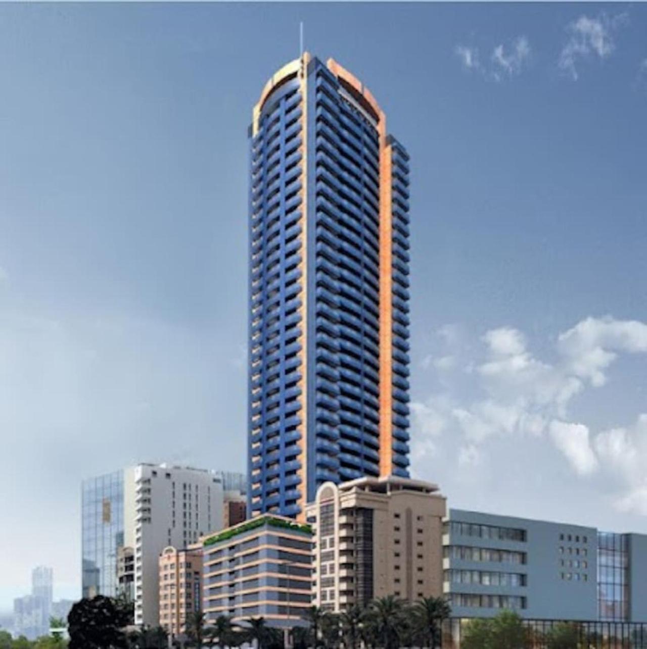 a tall skyscraper in the middle of a city at High Floor Era View Tower City View in Manama